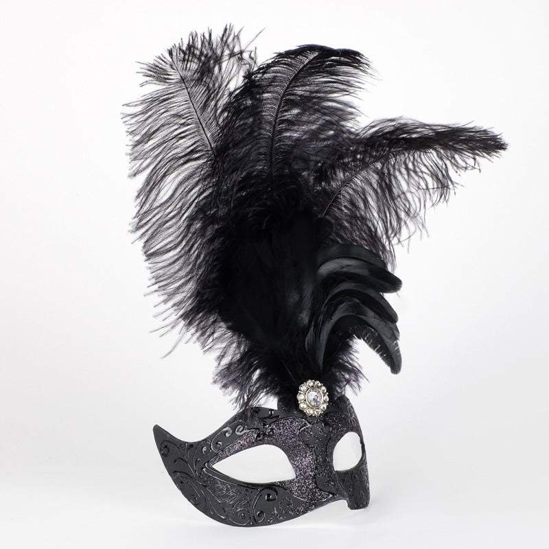 Angled view of Colombina Piume Stella All Black Venetian feather mask